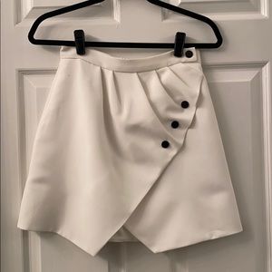 Sandro white mini skirt with black button detail